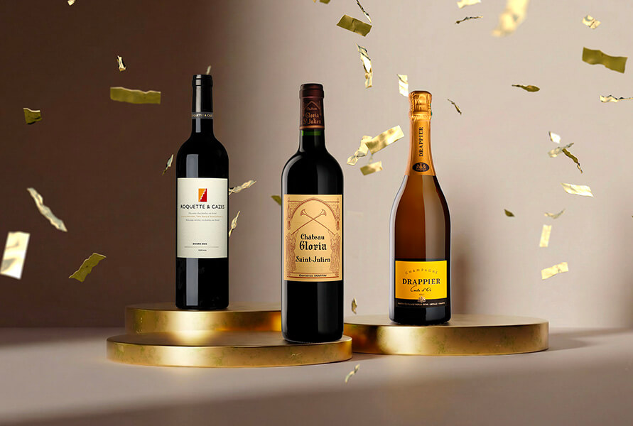 Three bottles of wine and champagne on golden podiums