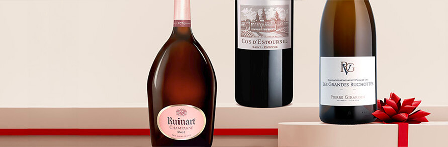 Three bottles of large format champagne, bordeaux wine and burgundy wine